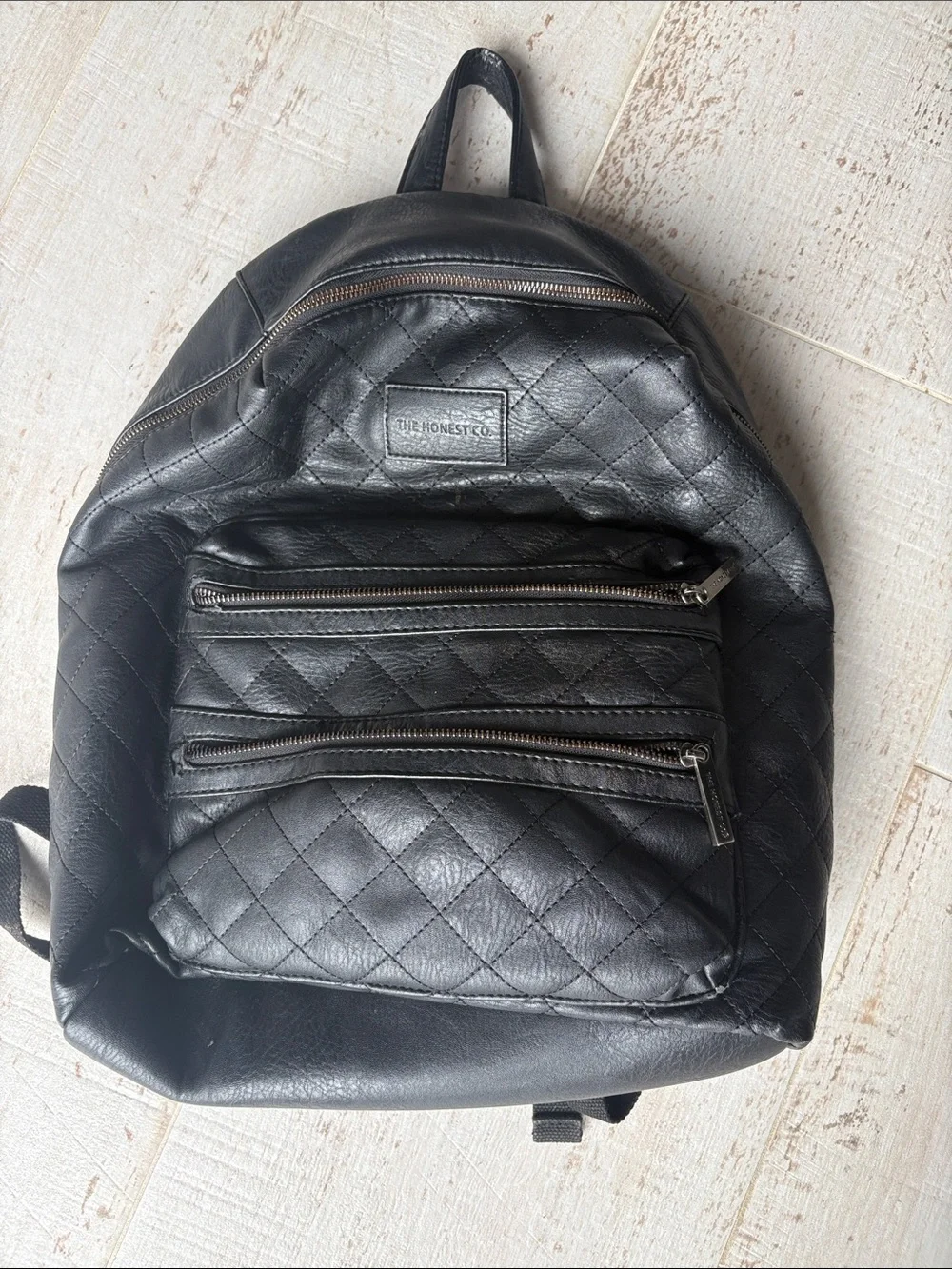 The Honest Company Diamond Quilted Black Faux Leather Backpack